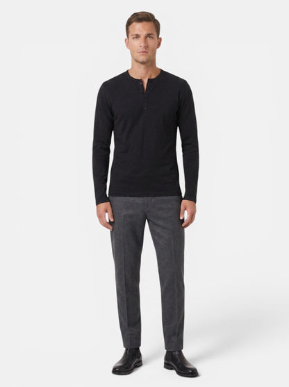 Men's black long-sleeve cotton blend Henley shirt with button placket and relaxed fit.