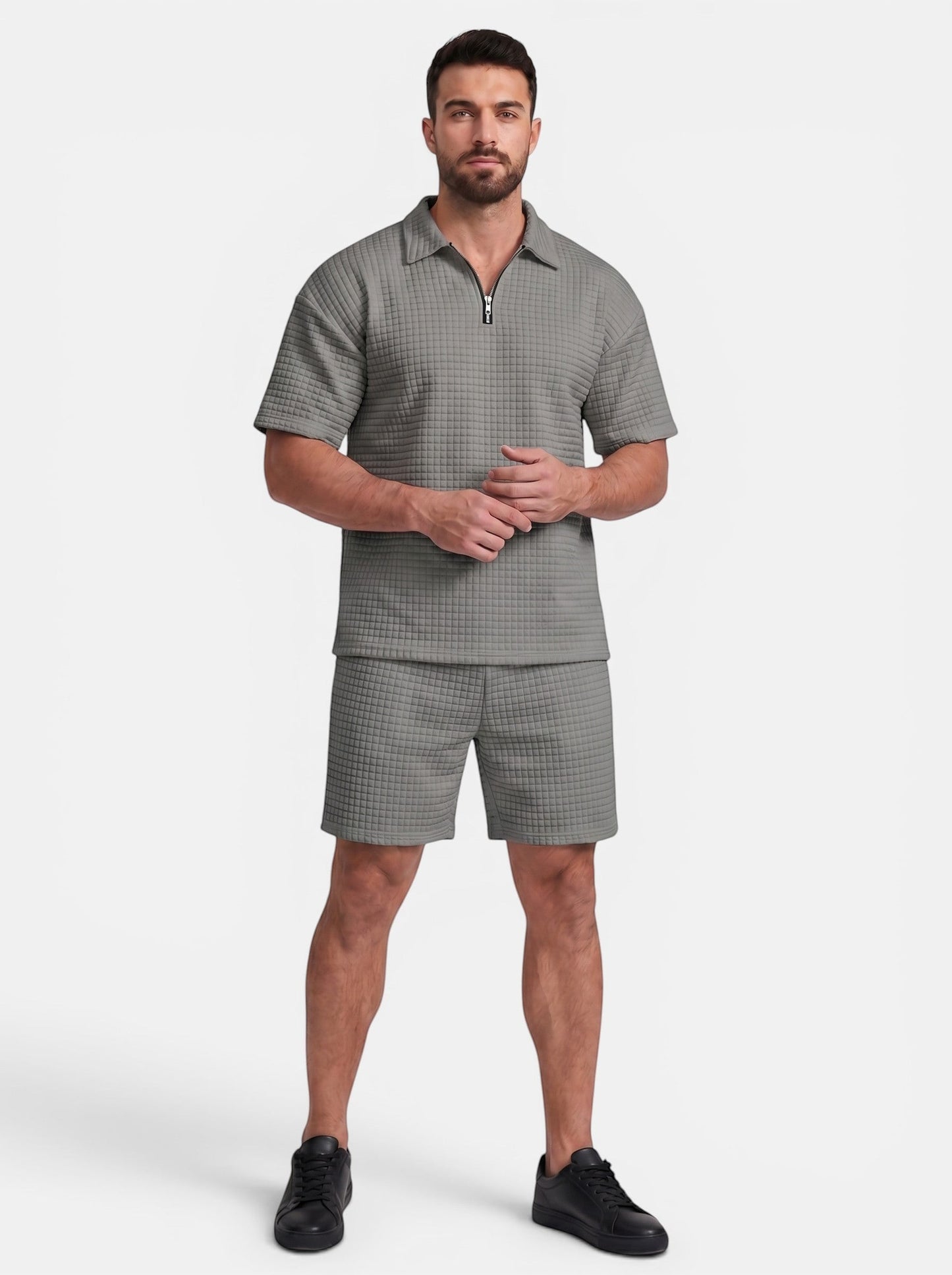 Men's grey quilted polyester short-sleeve polo shirt and shorts set with quarter-zip closure.