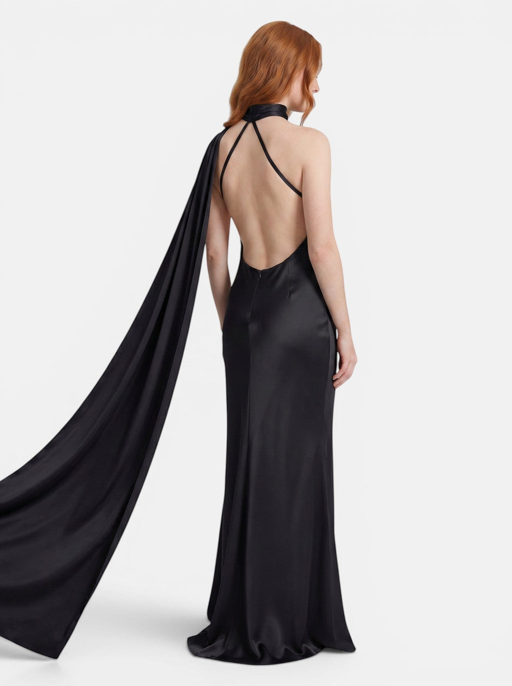 Venatte black satin style halter party dress with backless silhouette and flowing cape detail.