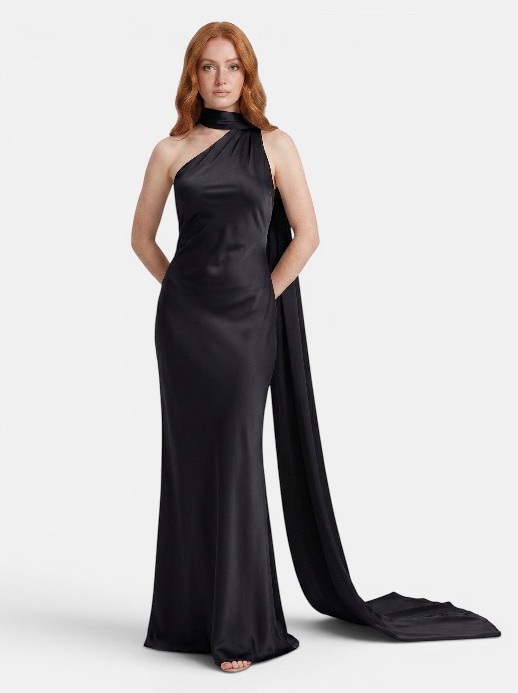 Venatte black satin style halter party dress with backless silhouette and flowing train.