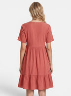 Venatte women's coral gauze mini dress with V-neck, short sleeves, and tiered ruffle hem. Bohemian style.