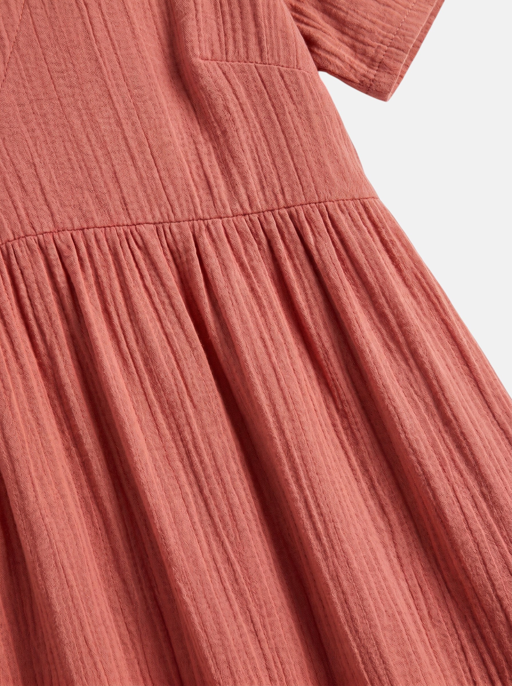 Venatte women's coral pink ruffled mini dress with V-neck and A-line silhouette, made of soft polyester blend.