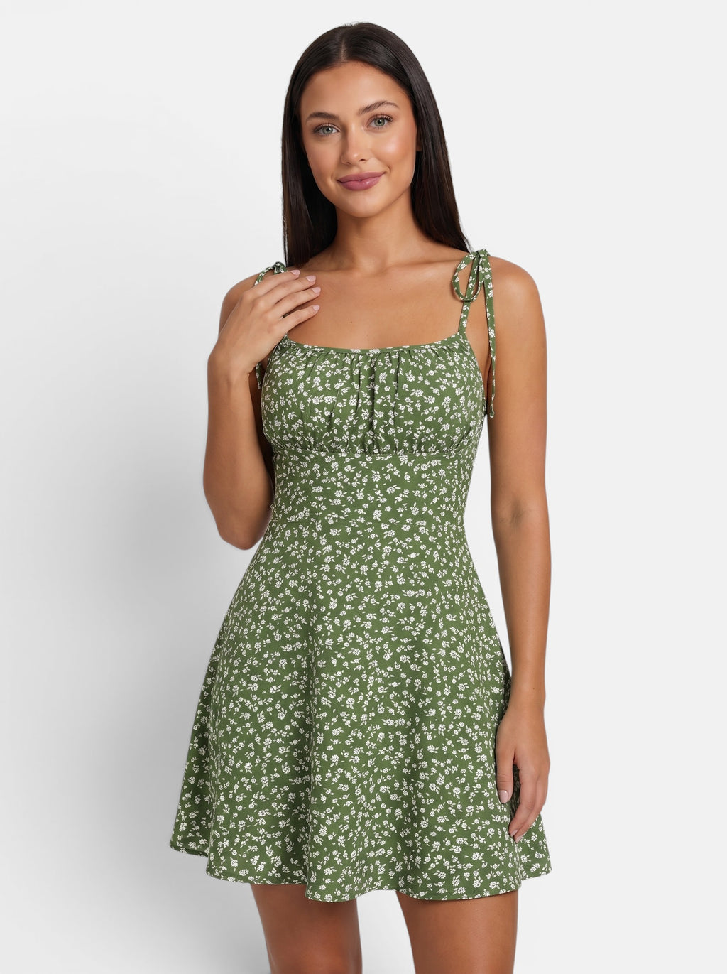 Venatte women's green floral mini sundress with spaghetti straps and tie details. Lightweight polyester blend.