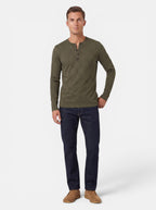 Venatte men's long-sleeve olive green cotton blend Henley shirt with button placket, paired with dark wash jeans.