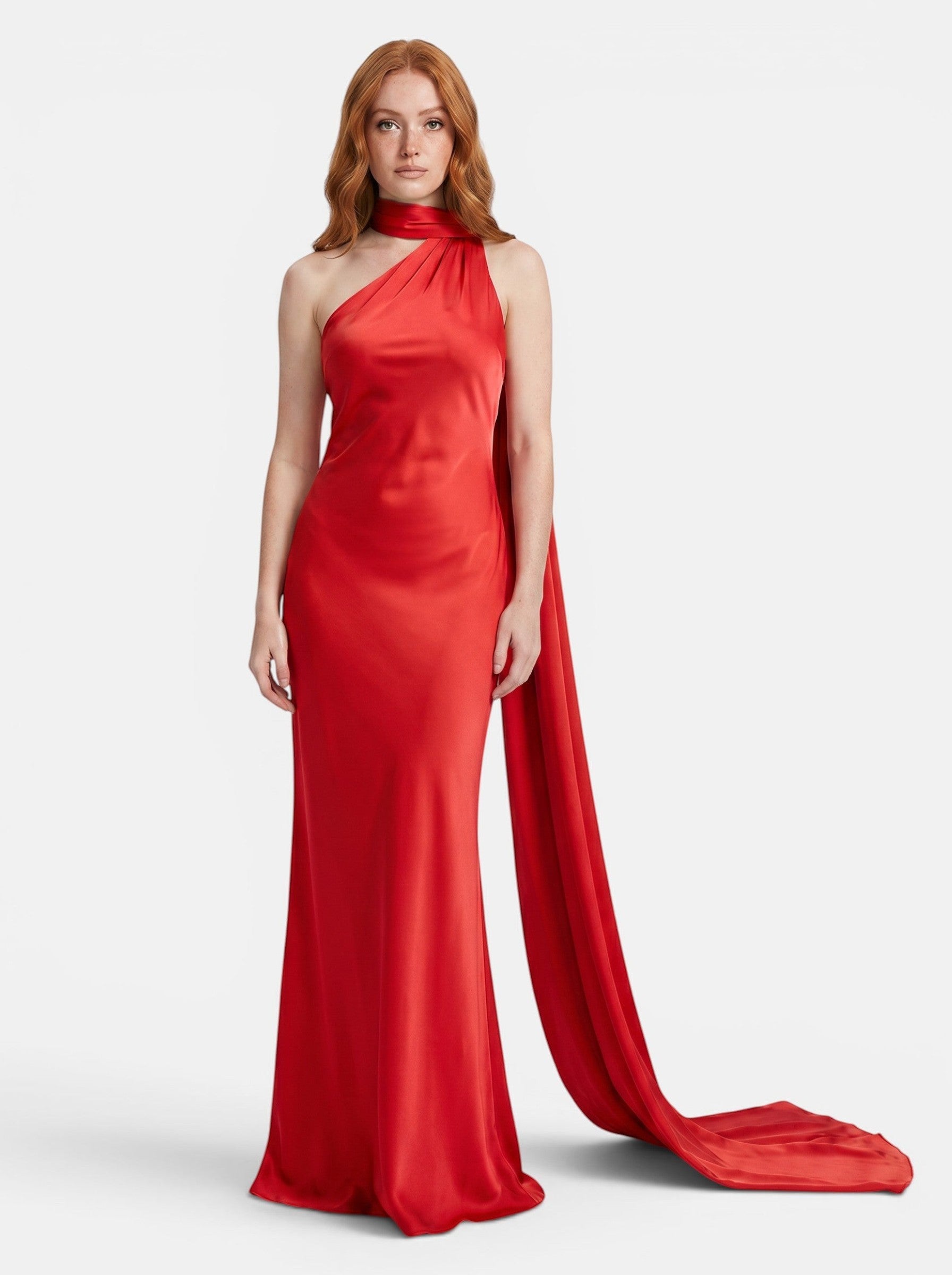 Venatte red satin style halter party dress with flowing train and backless silhouette.