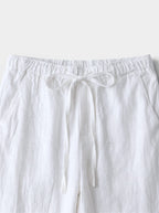 Venatte white cotton linen relaxed fit wide-leg casual pants with drawstring waist and back pocket.