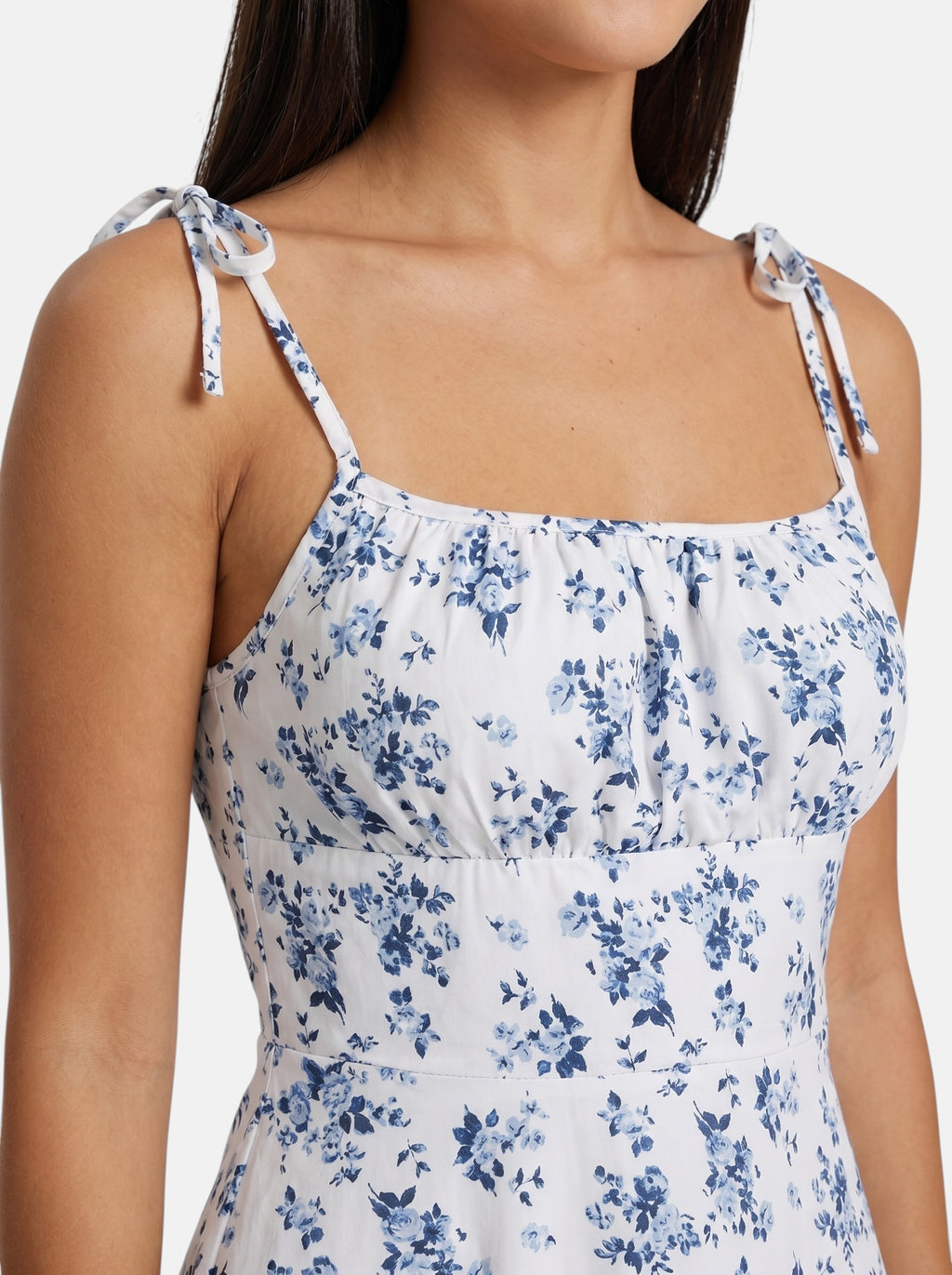 Venatte women's white mini sundress with blue floral print and tie spaghetti straps. Lightweight polyester blend.