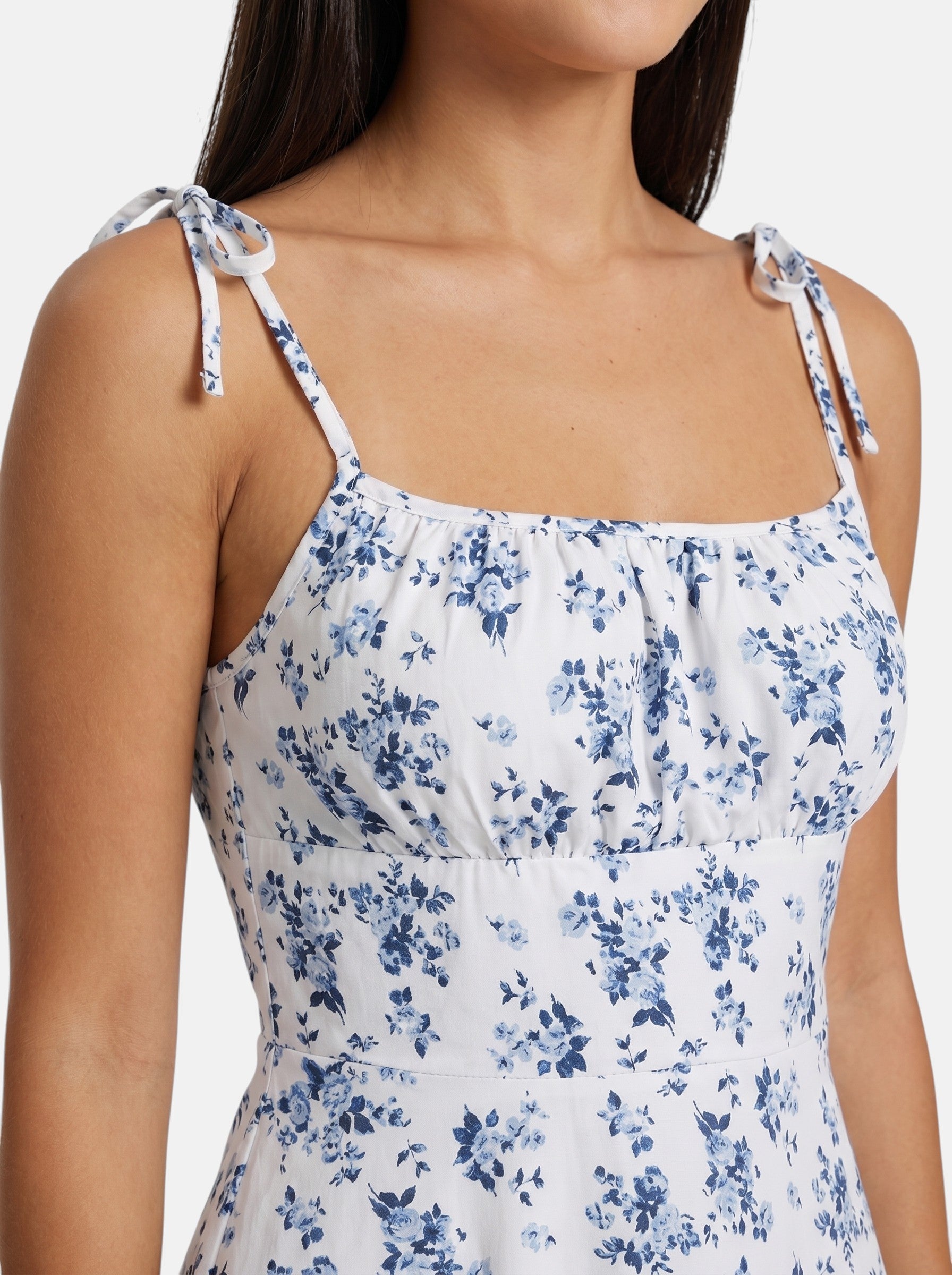 Venatte women's white mini sundress with blue floral print and tie spaghetti straps. Lightweight polyester blend.