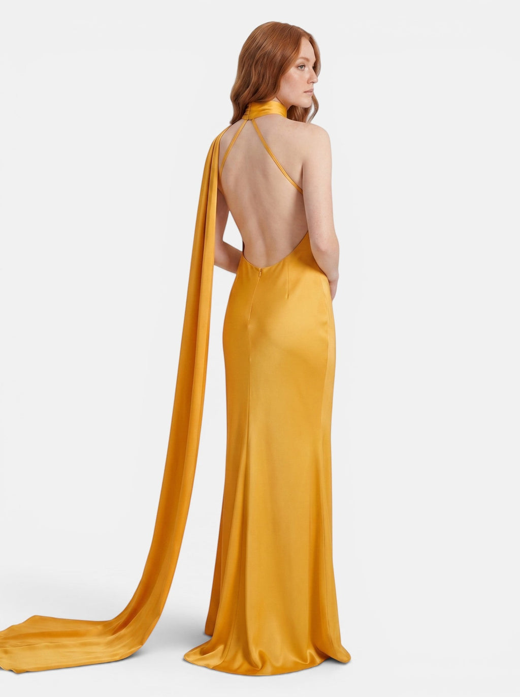 Venatte women's mustard yellow satin halter party dress with backless design and flowing scarf detail.