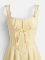 Venatte women's pale yellow A-line party dress with lace trim, pintuck detailing, and a tie-front bodice.