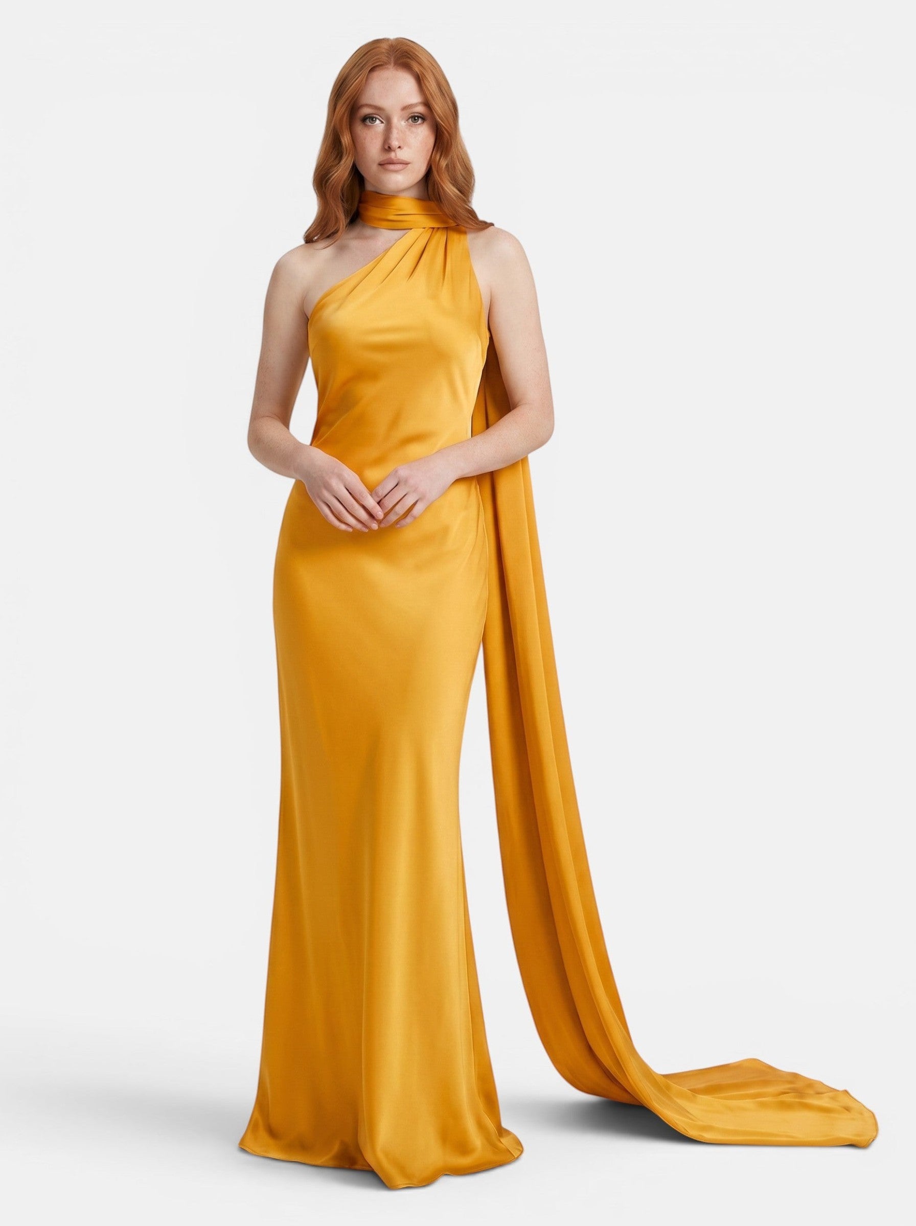 Venatte women's mustard yellow satin halter party dress with flowing train and backless silhouette.