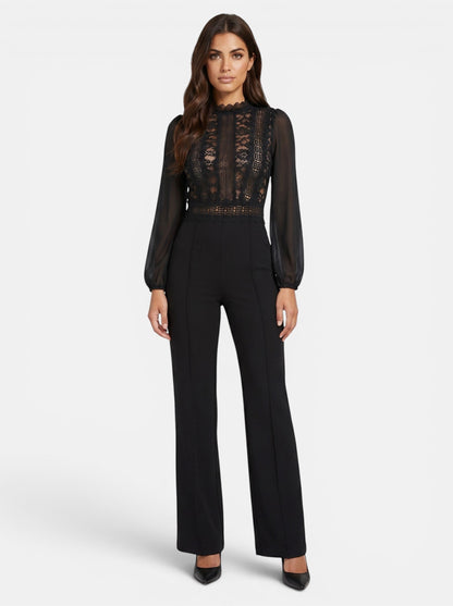 Women's black crochet lace mesh jumpsuit with long sheer sleeves and flared legs. Elegant evening wear.