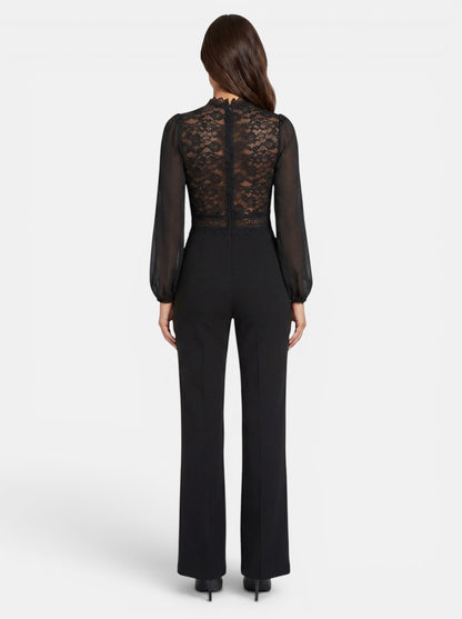 Women's black crochet lace mesh jumpsuit with long sheer sleeves and flared legs. Elegant evening wear.