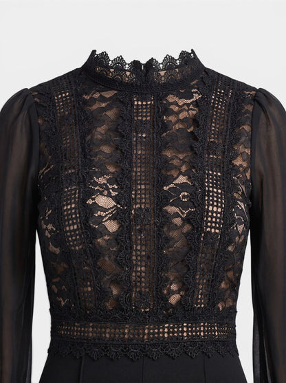 Women's black crochet lace mesh jumpsuit with sheer sleeves and mock neck. Perfect for evening events.
